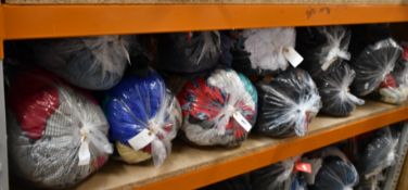 Eleven bags of assorted pre-owned clothing and related items.