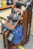 A Bluefin Blade Aqua Wood Rowing Machine (NOTE: Item may be incomplete, viewing is recommended).