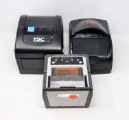 A pre-owned Cogent C500e Livescan Fingerprint Scanner, a pre-owned 3M AT9000 Passport/Full page ID