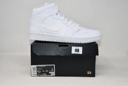 A pair of as new Nike Air Jordan 1 Mid (UK 9).
