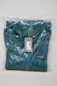 Four women's as new Patagonia R1 Daily Zip Neck tops in green (XS, S, M, L).