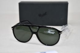 A pair of as new Persol sunglasses.