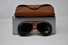 A pair of as new Ray Ban sunglasses.