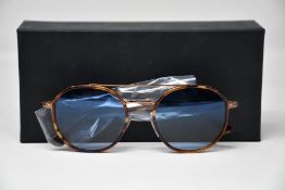 A pair of as new Persol sunglasses.