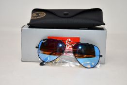 A pair of as new Ray Ban sunglasses.