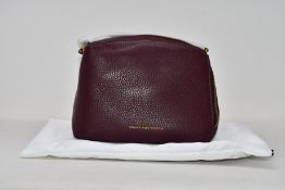 An as new Smaak Amsterdam Blake bag in burgundy.