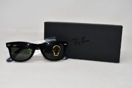 A pair of as new Ray Ban sunglasses.