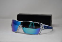 A pair of as new Oakley Turbine Rotor sunglasses.