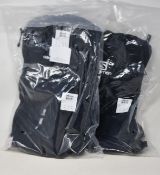 Three Salomon Trail Blazer backpacks and a Agile 12 hydration vest.