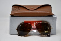 A pair of as new Ray Ban sunglasses.