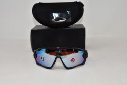 A pair of as new Oakley Jaw Breaker sunglasses.
