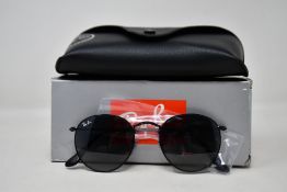 A pair of as new Ray Ban sunglasses.