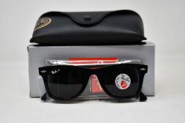 A pair of as new Ray Ban sunglasses.