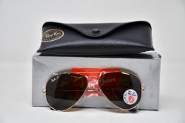 A pair of as new Ray Ban sunglasses.