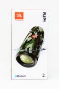 A boxed as new JBL Flip 5 Waterproof Portable Bluetooth Speaker in Camo (Box sealed).