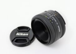 A boxed as new Nikon AF Nikkor 50mm f/1.8D Lens (Some damage to box).