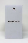 A boxed as new Huawei P30 lite (MAR-LX1A) 4GB/128GB in Midnight Black (Box sealed. Two pin plug).