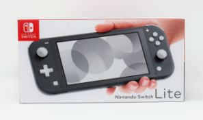 A boxed as new Nintendo Switch Lite Console in Grey (M/N: HDH-S-GAZAA-HKG) (Some packaging text in