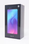 A boxed as new Xiaomi Mi 9T Dual LTE 64GB 6GB Smartphone in Carbon Black (Box sealed. 2-pin plug