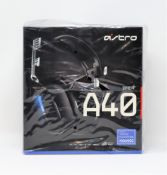 A boxed as new Astro A40 TR gaming headset for games consoles and PC inblack/silver (box damaged).