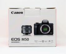 A boxed as new Canon EOS M50 Mirrorless Camera and EF-M15-45mm Lens Kit (2-pin plug).