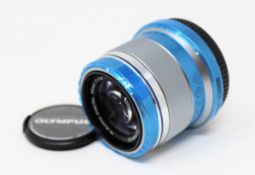 A boxed as new Olympus M.ZUIKO Digital 45mm f/1.8 Lens in Silver.