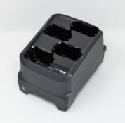 A boxed as new Zebra MC3300 4-Slot Battery Charger (P/N: SAC-MC33-4SCHG-01).