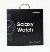 A boxed as new Samsung Galaxy Watch (SM-R810) 42mm in Midnight Black (Box sealed. UK plug).