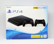 A boxed as new 500GB Sony PlayStation 4 games console in jet black (box damaged) (2 pin power