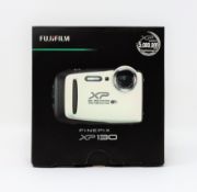 A boxed as new Fujifilm FinePix XP130 16.4MP Waterproof Camera in White (Two pin plug).