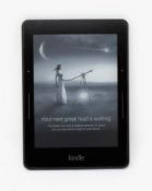 A pre-owned Kindle Voyage (7th Gen) in Black (Some cosmetic marks to rear casing).