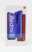 A boxed as new Xiaomi Redmi 8 3GB/32GB in Sapphire Blue (Box sealed. Two pin plug).