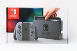 A boxed as new Nintendo Switch Console in Grey (M/N: HAC-S-KAAAA-JPN) (Some packaging text in
