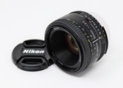 A boxed as new Nikon AF Nikkor 50mm f/1.8D Lens (Some damage to box).