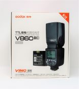 A boxed as new Godox V860IIC TTL Camera Flash for Canon (Two pin plug included).