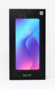 A boxed as new Xiaomi Mi 9T Dual LTE 128GB 6GB Smartphone in Glacier Blue (Box opened. 2-pin plug