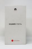 A boxed as new Huawei P30 Pro VOG-L29 8GB/256GB in Breathing Crystal (Box sealed. UK plug).
