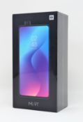 A boxed as new Xiaomi Mi 9T Dual LTE 128GB 6GB Smartphone in Glacier Blue (Box sealed. 2-pin plug