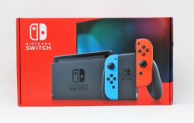 A boxed as new Nintendo Switch Console in Neon Red/Blue (M/N: HAC-S-KABAA-JPN) (Some packaging