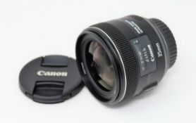 A boxed as new Canon EF 35mm f/2 IS USM Lens.