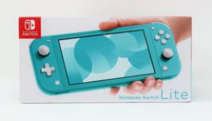 A boxed as new Nintendo Switch Lite Console in Turquoise (M/N: HDH-S-BAZAA-AUS) (Two pin plug