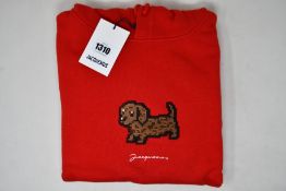 An as new Jacquemus Le Sweatshirt Pistoun hoodie in red (XS).