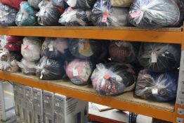 Twelve bags of pre-owned clothing and related items.