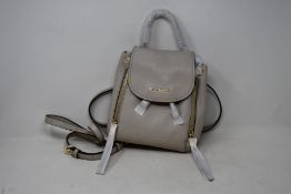 An as new Michael Kors Viv mini backpack.