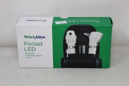 A boxed as new Welch Allyn pocket LED Ophthalmoscope in purple (REF: 12870-PUR).