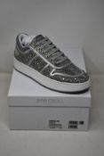 A pair of as new Jimmy Choo Hawaii sneakers (EU 38.5).