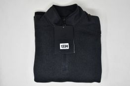 An as new Arc'Teryx Covert 1/2 zip top (M).