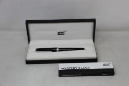 A boxed as new Mont Blanc Pix ball point pen.