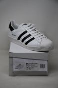 A pair of as new Adidas Prada Superstar sneakers (UK 12).