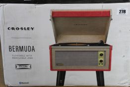 An as new Crosley Bermuda Dansette Series bluetooth turntable with removable legs.